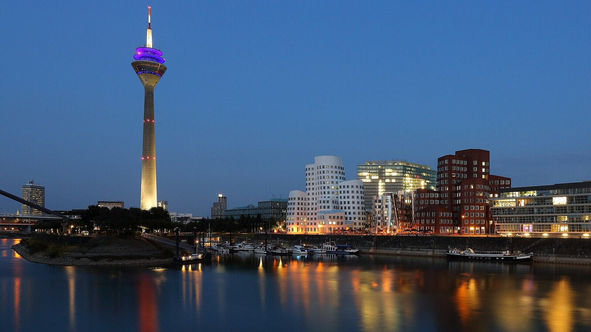 The Rheinturm and the Neuer Zollhof in Düsseldorf's Medienhafen at blue hour